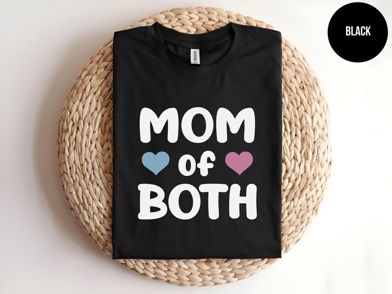 May include: Black t-shirt with white text that reads "MOM of BOTH" with a blue heart and a pink heart.
