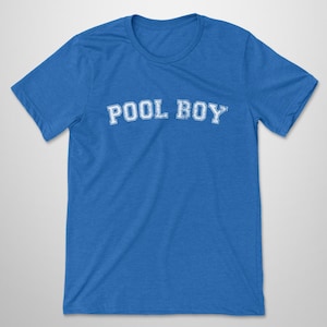 May include: A bright blue short-sleeved t-shirt featuring the text POOL BOY printed in a white, distressed, collegiate-style font across the chest. The garment has a crew neckline and a standard fit, showcasing a simple and clean design.