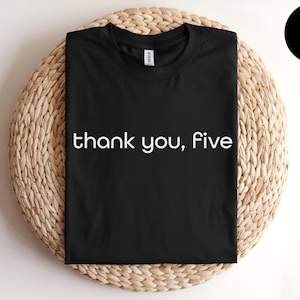 May include: Black t-shirt with white text that reads "thank you, five".