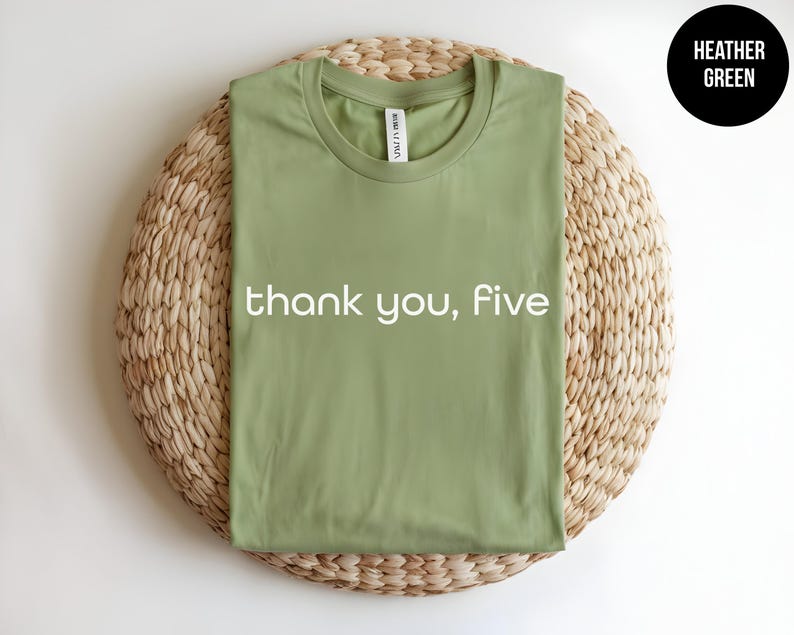 May include: A heather green t-shirt with the text "thank you, five" printed in white.