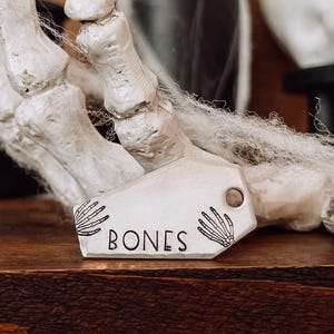 Custom Personalized Dog Tag, Pet ID Tag, Metal Hand Stamped Dog Tag | Halloween, Spooky | Skeleton Hands Coffin Shaped Dog Tag 7/8&quot; x 1 1/2&quot;