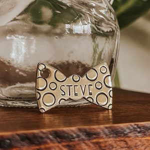 Custom Personalized Dog Tag, Pet ID Tag, Metal Hand Stamped Dog Tag | Bubbles, Polka Dots | Polka Dot Bow Tie Shaped 3/4" x 1 1/4" w/Texture