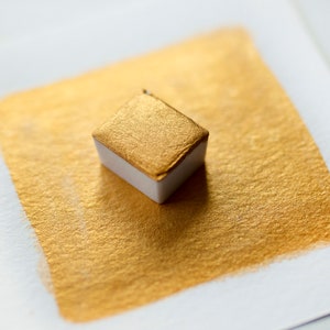 Warm Gold mica watercolor paint half pan. Handmade pearlescent yellow gold color.
