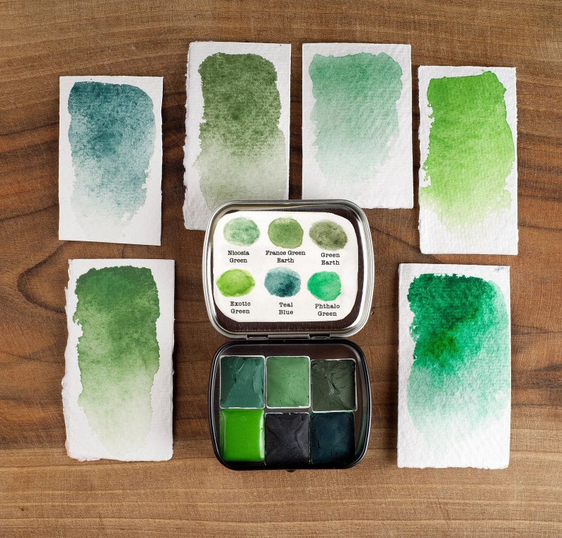 Handmade watercolor palette with 6  green colors. Handmade paint. 6 half pans in a metal tin. Art supply.
Green watercolor paint.