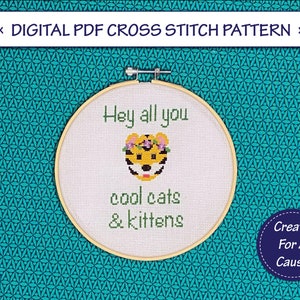 May include: Cross stitch pattern featuring a cartoon tiger wearing a flower crown with the text "Hey all you cool cats & kittens".