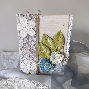 Joli mini album de 10x15cm composé de 4 livrets avec plusieurs feuilles, décorés avec des techniques de ferraille et divers ornements.