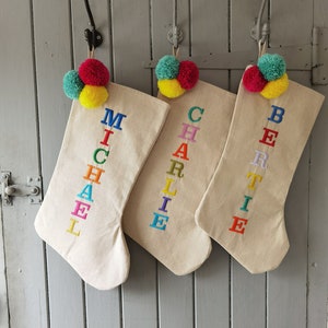 Luxury personalised linen Christmas stocking with pom poms