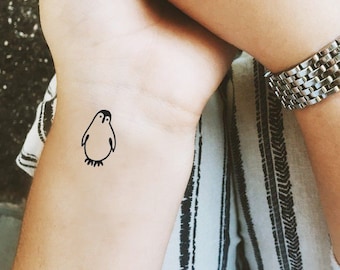 16 Stylish Penguin Wrist Tattoo Designs  Tattoo Designs  TattoosBagcom