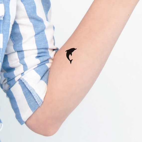 19 Outstanding Dolphin Tattoos On Foot  Tattoo Designs  TattoosBagcom