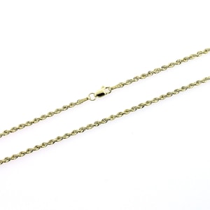 May include: A gold rope chain necklace with a lobster clasp.