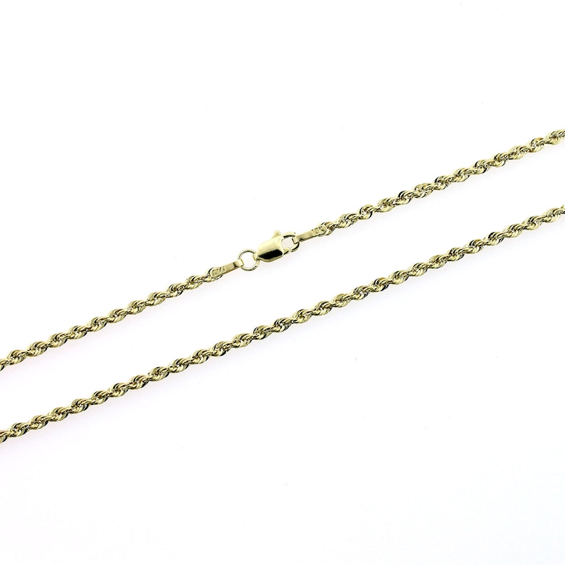 May include: A gold rope chain necklace with a lobster clasp.