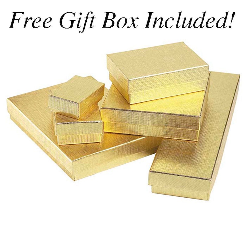 May include: A set of five gold gift boxes of various sizes. The boxes are made of cardboard and have a textured finish. The text "Free Gift Box Included!" is visible at the top of the image.