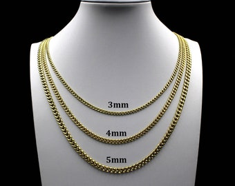 May include: Three gold curb chains of different widths, 3mm, 4mm, and 5mm, displayed on a white mannequin.