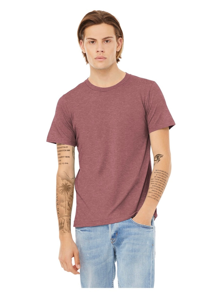 May include: A heather red short-sleeved t-shirt with a crew neck. The t-shirt is made of a soft, comfortable material and has a relaxed fit.