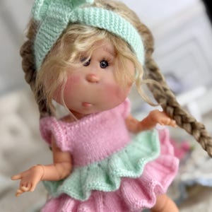 Knitted dress for Mia nines d’onil doll 23 cm.