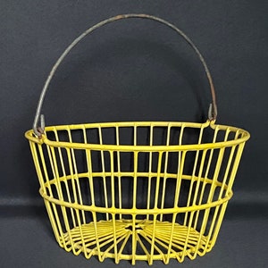 Large yellow plasticized wire steel basket in the style of Tomado