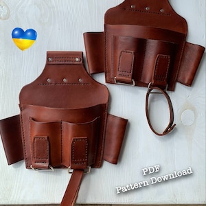 Peut inclure: Deux ceintures &agrave; outils en cuir marron avec plusieurs poches et une sangle. Le texte "PDF Pattern Download" est visible dans le coin inf&eacute;rieur droit de l'image.