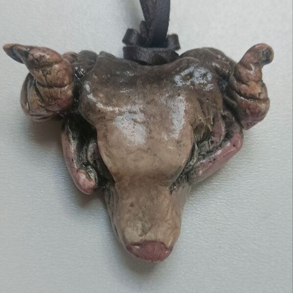 The pendant features a large ram's head BIG Horns Rat's eyes