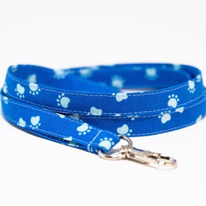 Light blue paws on blue lanyard, optional breakaway, 1/2&quot; wide, skinny fabric lanyard, badge holder, ID strap, key fob