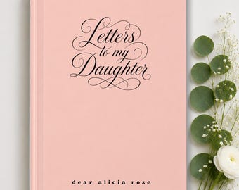 May include: A light pink hardcover book with the black cursive text Letters to my Daughter centered on the front cover. Below the title, the text dear alicia rose is printed in a simple black sans-serif font. The book has a smooth finish.