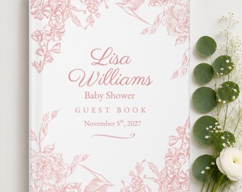 May include: A white guest book with pink floral and bird illustrations. The text reads: Lisa Williams, Baby Shower, GUEST BOOK, November 5th, 2027. The cover features a delicate botanical border design with pink line art on a clean white background.