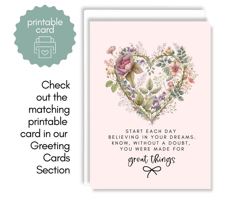 May include: A pale pink greeting card featuring a heart-shaped wreath made of various colorful flowers and green leaves. Below the floral heart, the text reads: START EACH DAY BELIEVING IN YOUR DREAMS. KNOW, WITHOUT A DOUBT, YOU WERE MADE FOR great things.