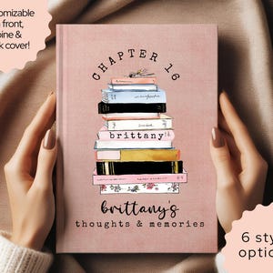 May include: A pink journal featuring a stack of books illustration. The cover displays "Chapter 16" and "brittany's thoughts & memories". It's customizable on the front, spine, and back, with six style options available for the journal.