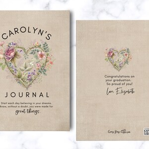 May include: A beige journal with a textured cover featuring a floral heart illustration. The front reads CAROLYN'S JOURNAL and includes an inspirational quote. The back displays a smaller floral heart, a graduation message, and a small QR code.