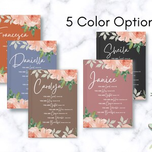 May include: Five hardback journals in different colours including rust, blue, brown, black, and mauve. Each journal features a floral design with peach-coloured flowers and green leaves, a custom name, and the text You Are Loved, His, Chosen, Heir, Valuable, and Beautiful.