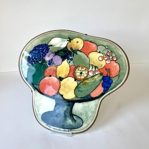 Arabia, Finland. Helja Liukko-Sundström Ceramic Wall Plaque or Trivet. Fruit platter motif with metal wall mounting.