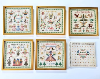 1961 framed cross stitch designs from Haandarbejdets fremme yearbook 1961 - Cross Stitch month motives by Ida Winckler & Agnete.