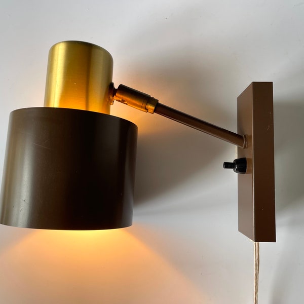 Brass and brown Alfa sconce designed by Jo Hammerborg for the Danish company Fog & Morup / Fog and Mørup. Plug type: European or American.