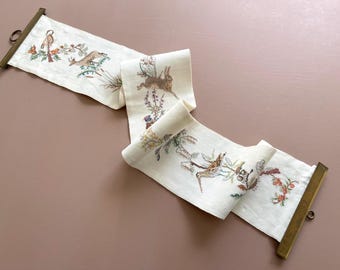 Cross stitch hunting/game motifs. Embroidered 60s 70s wall hanging / bell pull. Handmade. Fabric with duck, deer, hare, duck, dog & pheasant