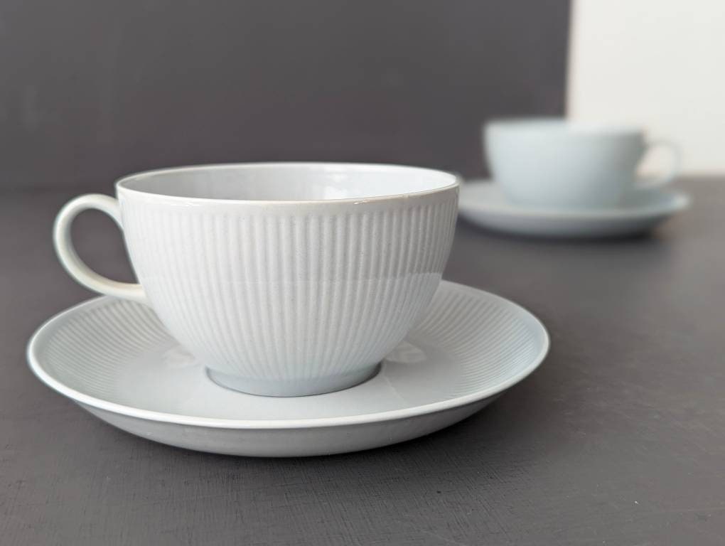 TEA cup Arabia SOINTU - Arabia of Finland - by Kaj Franck. 1960s design. Light blue tea cup and saucer, minimalistic line pattern. Nordic