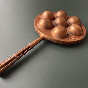 May include: A rustic wooden sign with the text "Welcome to our home" in white lettering. The sign features a distressed finish and a simple, inviting design, perfect for front door decor.