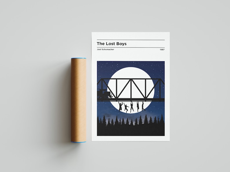 May include: A minimalist poster with a black and white illustration of a bridge with people hanging from it, set against a backdrop of a full moon and a starry night sky. The text "The Lost Boys" is at the top of the poster, with "Joel Schumacher" and "1987" below it.