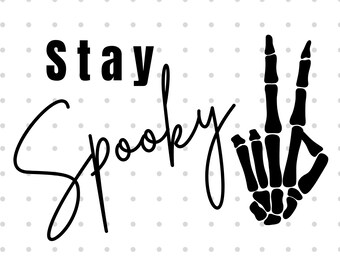 May include: Black and white graphic design with the text "stay spooky" and a skeleton hand making a peace sign.