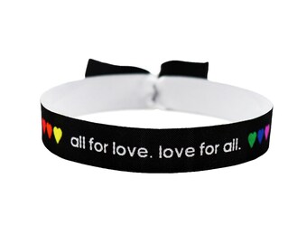 May include: Black elastic bracelet with the text "all for love. love for all." and rainbow hearts.