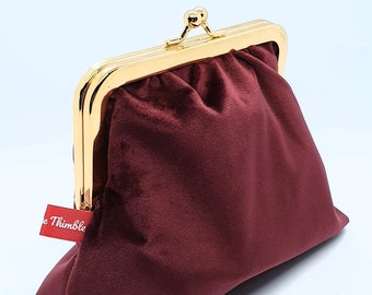 burgundy clutch bags