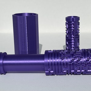 May include: Three purple 3D printed tubes, one with a textured surface and two with smooth surfaces.