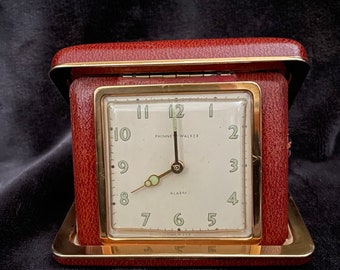 Antique Phinny-Walker Bedside travel clock. Cased in leather, Circa 1940’s The clocks mechanism serviced & case restored.