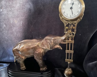 Junghans mystery swinging elephant clock