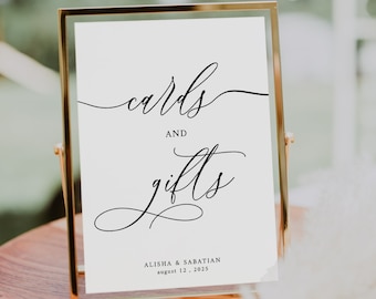 May include: A gold-framed sign with white background and black calligraphy text that reads "cards and gifts" with the names Alisha & Sabatian and the date August 12, 2023.