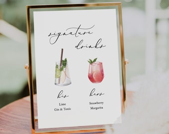 May include: A white sign with gold trim, featuring the text "signature drinks" in cursive. The sign displays two illustrated cocktails, labeled "his" and "hers" with descriptions of "Lime Gin & Tonic" and "Strawberry Margarita".