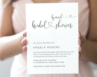 May include: A white card with black text announcing a by-mail bridal shower for Angela Rogers. The card includes the address to send gifts and the registry information.