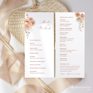 May include: Wedding ceremony program with a floral design in peach and pink tones. The program lists the order of events for the ceremony, including the prelude, processional, readings, exchange of vows, and recessional. The program also includes a list of the wedding party members and their roles.