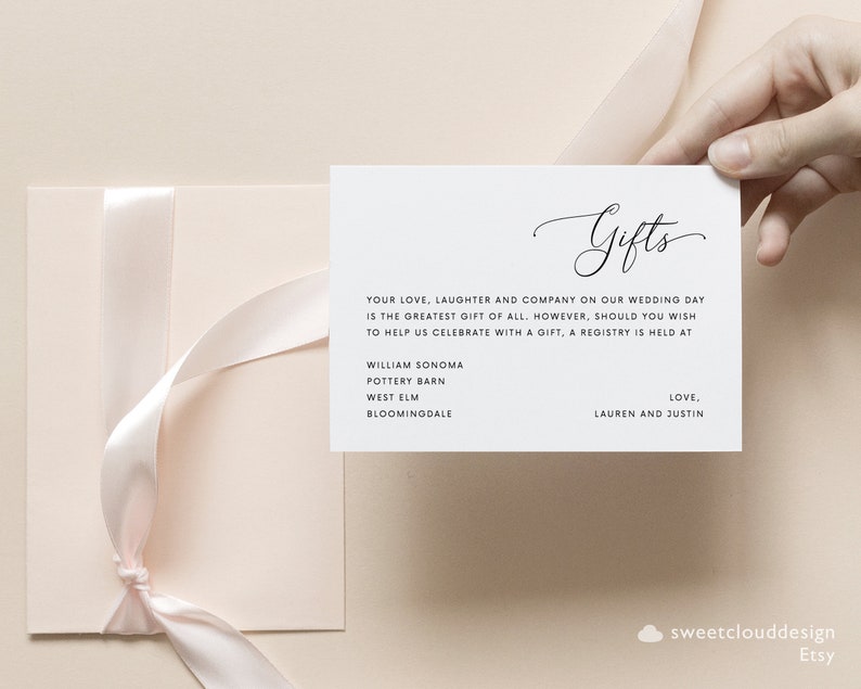May include: A white card with the word "Gifts" written in cursive. The card lists a few stores where a wedding registry is held, including William Sonoma, Pottery Barn, West Elm, and Bloomingdale's. The card also includes the text "Your love, laughter and company on our wedding day is the greatest gift of all. However, should you wish to help us celebrate with a gift, a registry is held at... Love, Lauren and Justin."