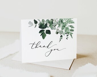 May include: A white card with a green watercolor floral design and the text "thank you" in black calligraphy.