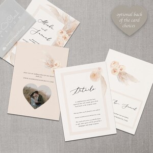 May include: Wedding invitation suite with a blush pink and cream color scheme. The front of the invitation features a floral design with pampas grass. The back of the invitation has the couple's names, "Alisha and Jamel", and the wedding website address. The details card includes information about the wedding ceremony and reception.