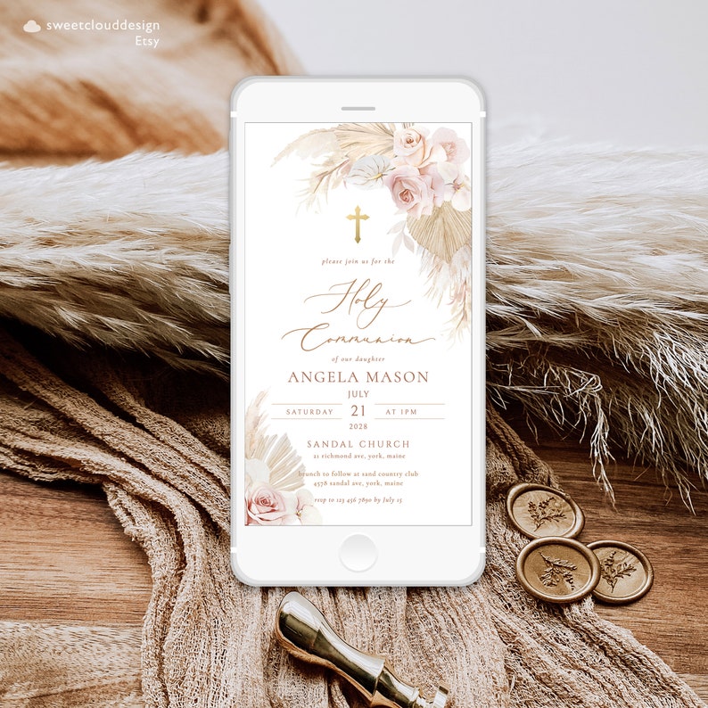 May include: A digital invitation for a Holy Communion celebration for Angela Mason. The invitation features a white background with a gold cross, floral illustrations, and a beige and brown pampas grass design. The text reads "Please join us for the Holy Communion of our daughter Angela Mason, July 21, 2028 at 1 PM, Sandal Church, 12 Sandal Ave, York, Maine. Brunch to follow at Sand Country Club, RSVP to (207) 496-1890 by July 15."